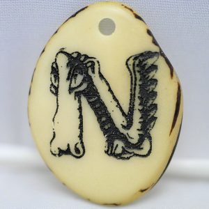 Tranche Tagua gravée lettre N