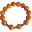 Bracelet artisanal en tagua orange avec 14 perles et éléments en acier